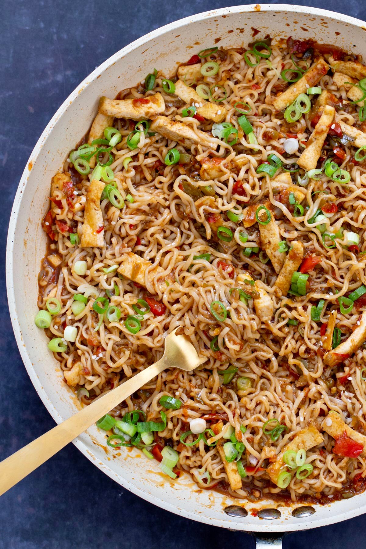 noodles in a skillet with a fork