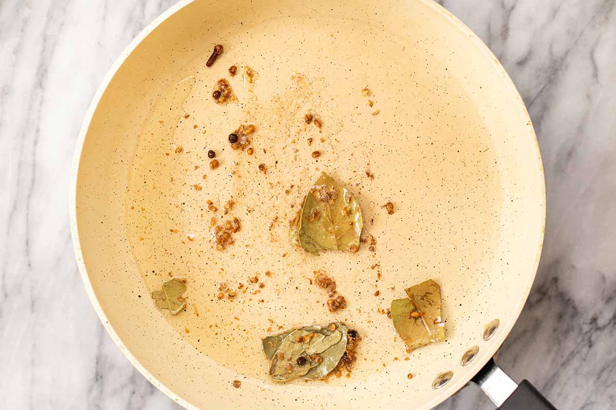 toasting the whole spices in the pan