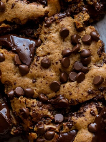 close-up overhead shot of almond butter blondies on a cutting board after slicing
