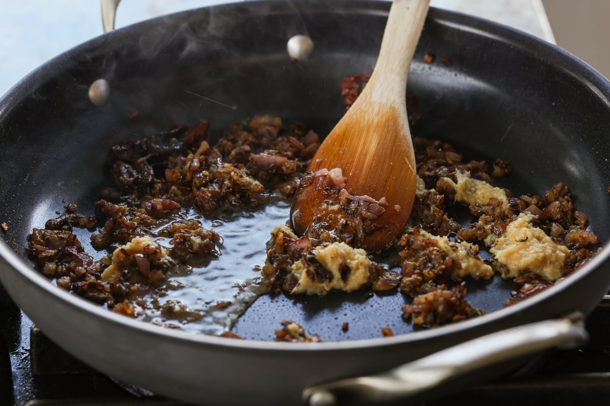 adding ginger garlic paste to the pan