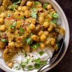 close-up of Andhra green chili chickpeas in a bowl with rice and cilantro