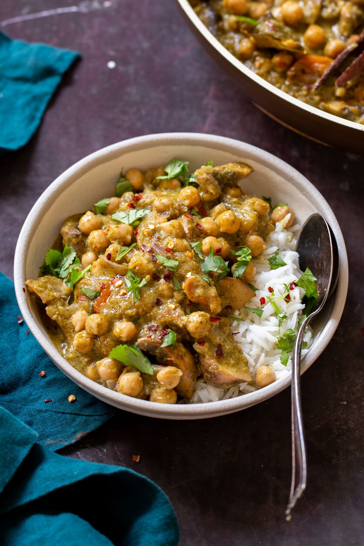 bowl of Andhra green chili chickpeas next to the pan