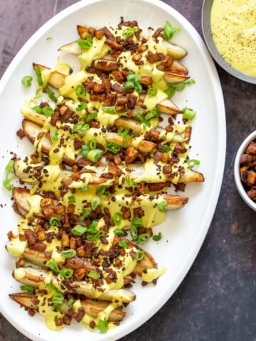loaded baked potato wedges served with vegan cashew cheese sauce