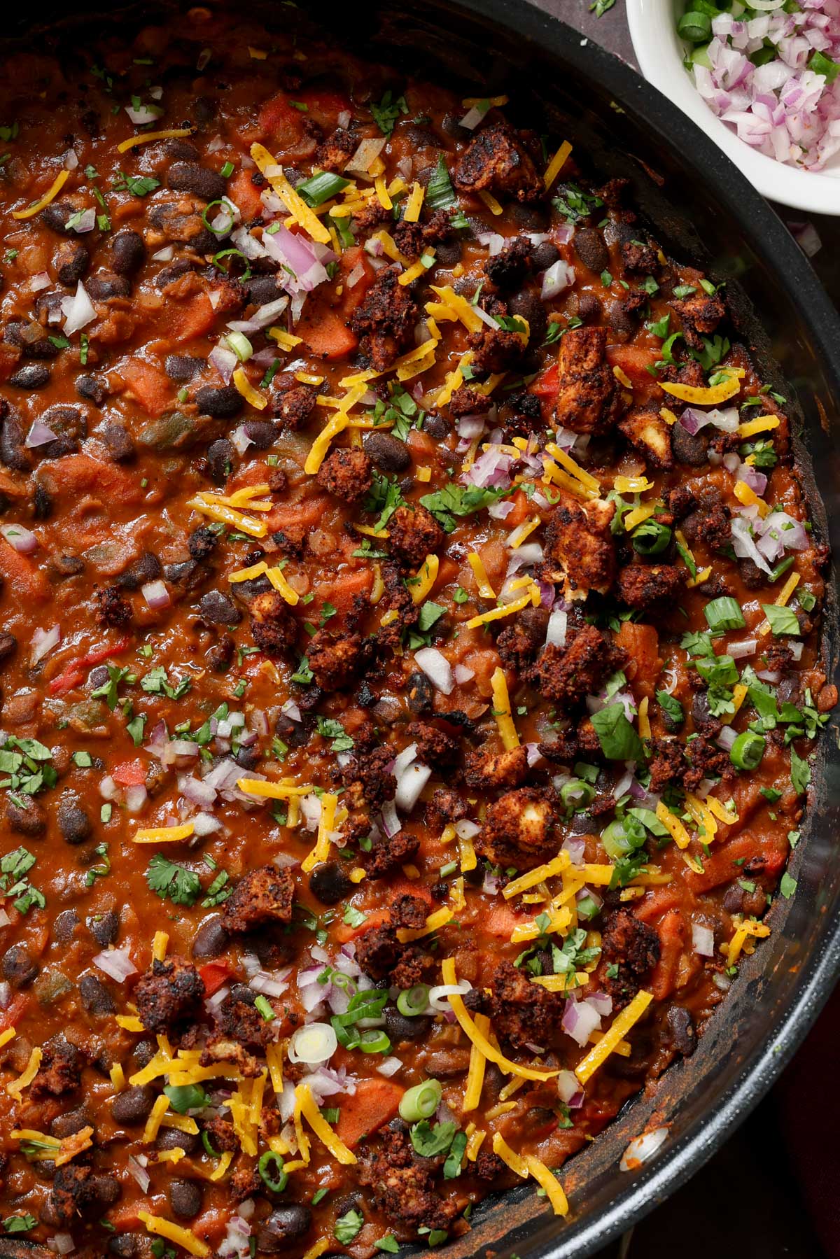 close-up of cooked beans in the pan after adding toppings