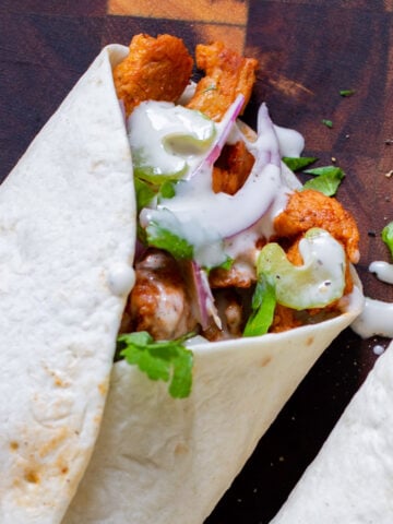 close-up of the top of a closed buffalo cajun wrap, so you can see the soy curls
