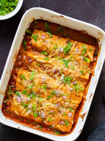 butter chicken enchiladas in the baking pan