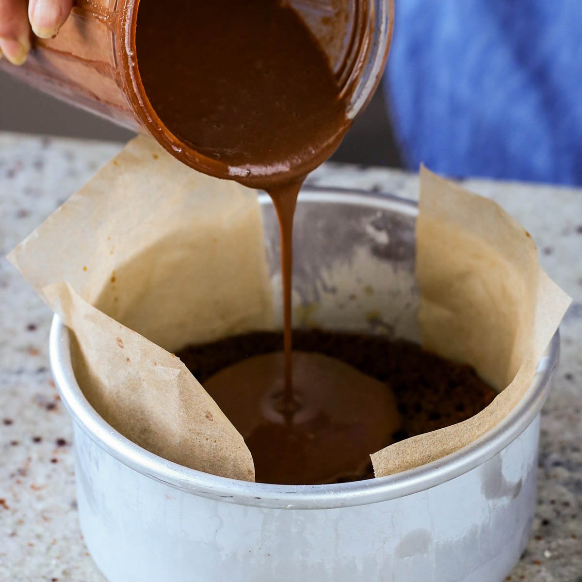 pouring on first layer of mocha pudding