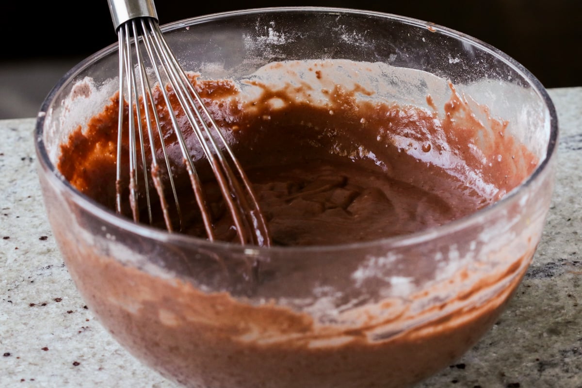 mocha cake batter in the bowl after adding the wet ingredients