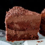 close-up of a slice of vegan mocha cake from the side, so you can see the layers