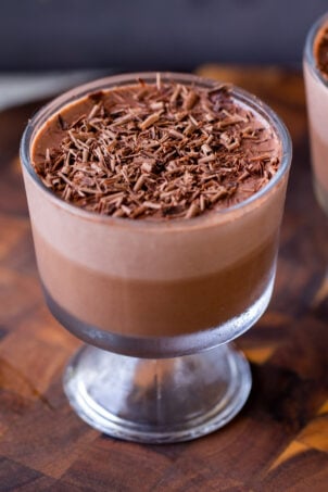 cup of two-layer vegan chocolate pudding with chocolate shavings on top