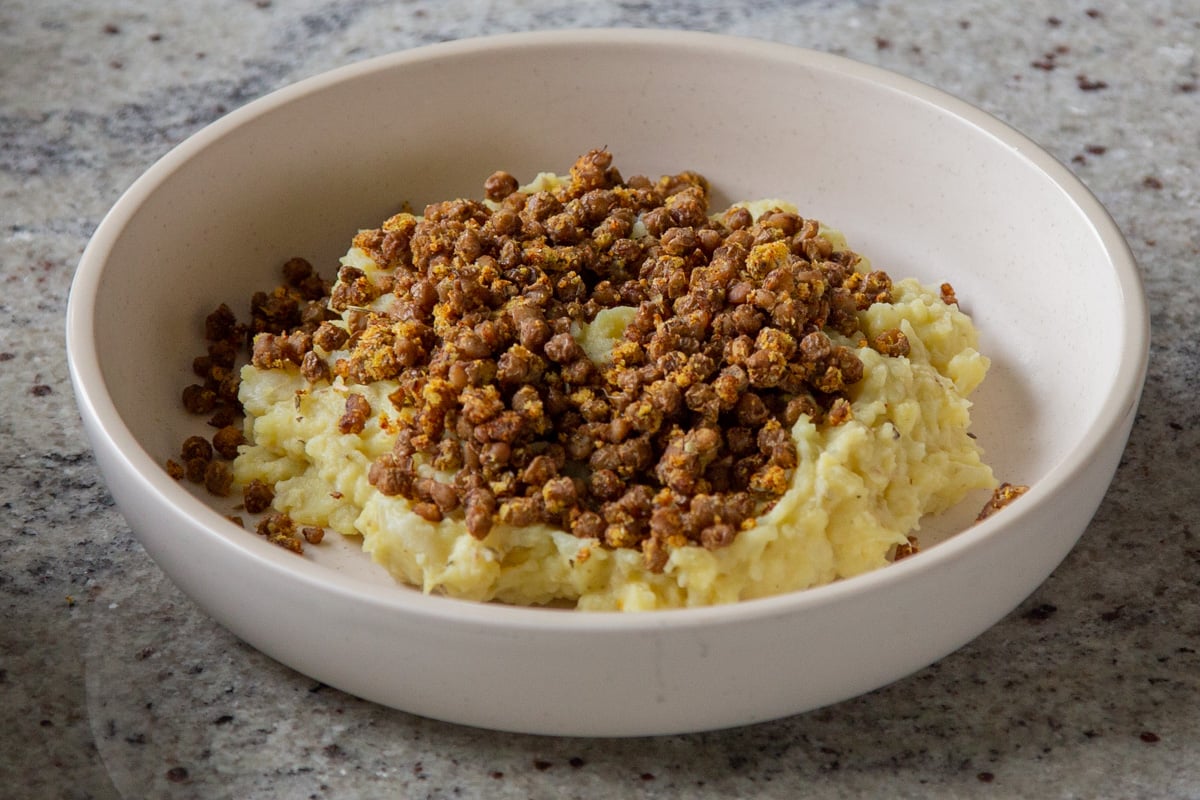 potato-cauliflower mash in a bowl with lentils