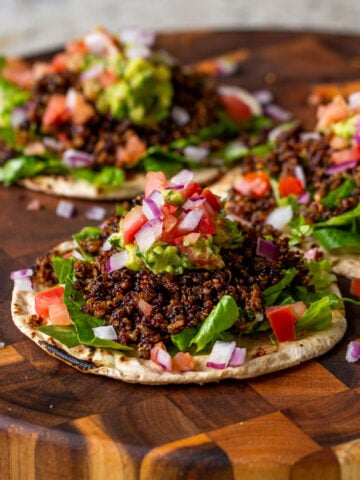 3 crispy quinoa tacos on a serving tray