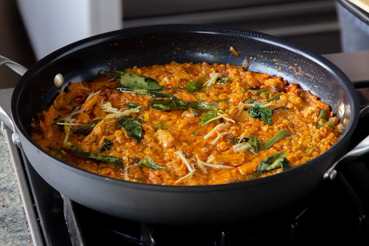 vegan dalcha in the pan topped with the tempering