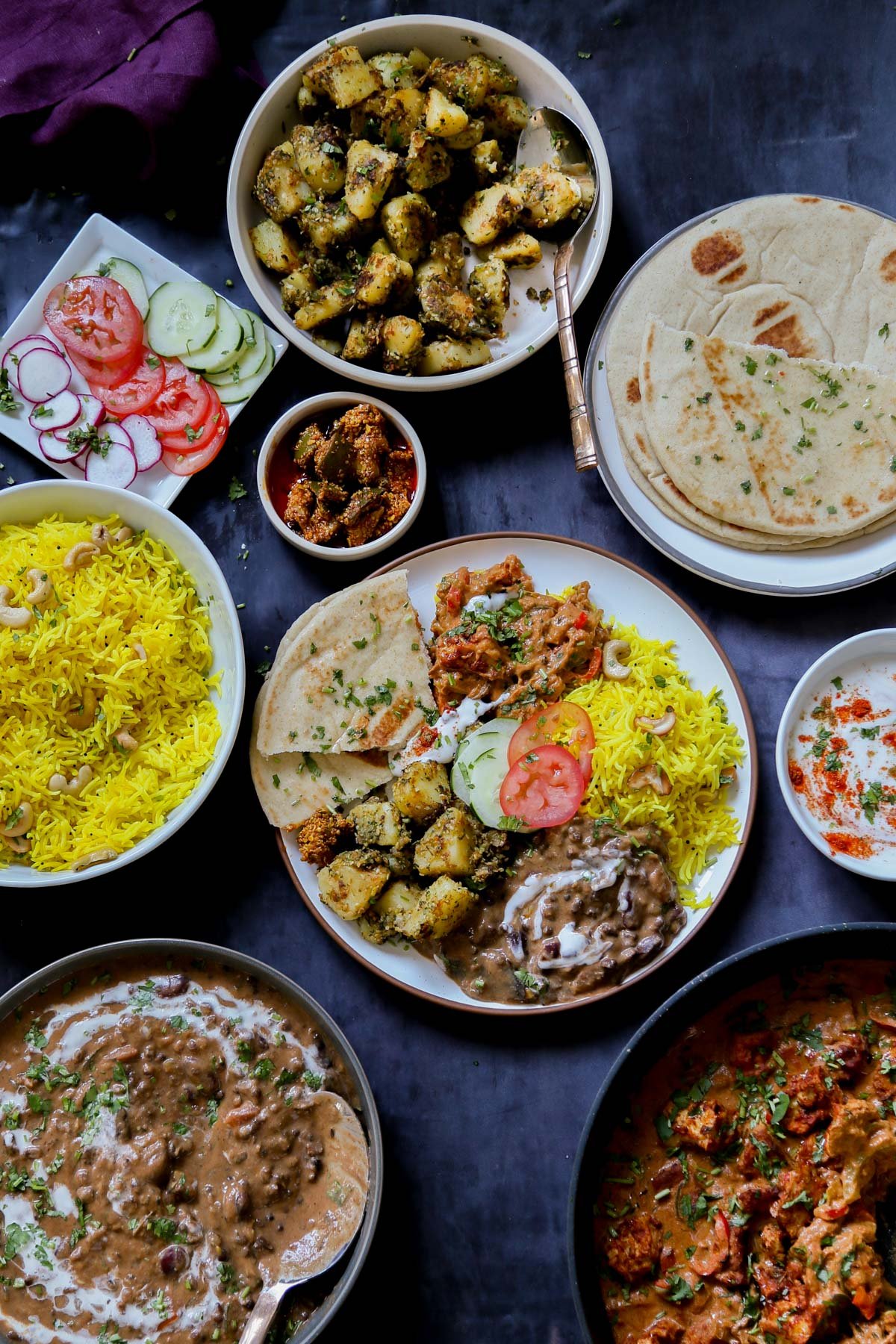 no onion no garlic Diwali menu on serving plates and one dinner plate with all the dishes