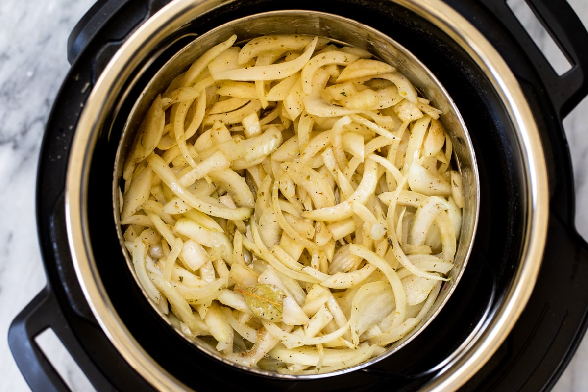 ingredients for caramelized onions in the inner pot of an Instant Pot