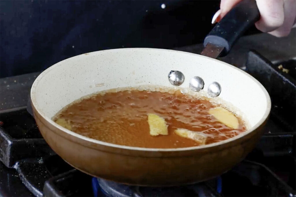 fresh ginger simmering in the syrup