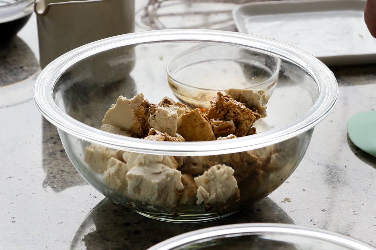 adding seasoning to the tofu