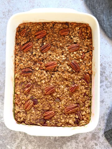 Vegan Gingerbread Baked Oatmeal in a white baking dish