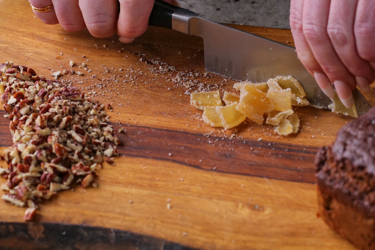 chopping candied ginger on a cutting board