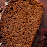 close-up of a slice of vegan gingerbread cake on a cutting board