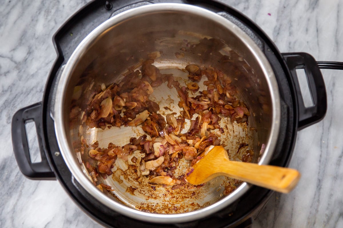 browned onion and garlic in an Instant Pot 