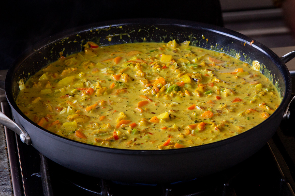 rice stirred into the Jamaican curry sauce