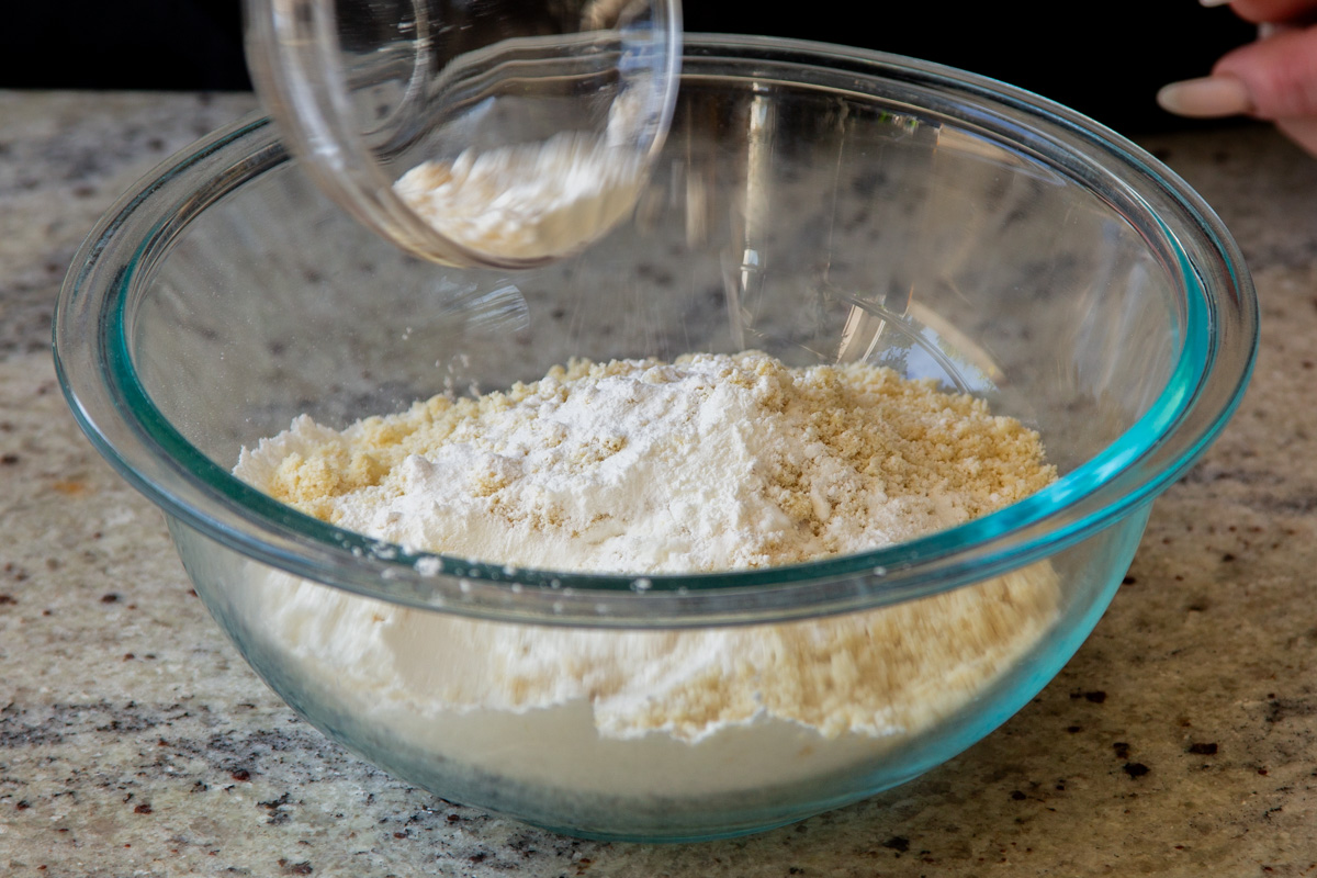 adding the dry ingredients to the bowl