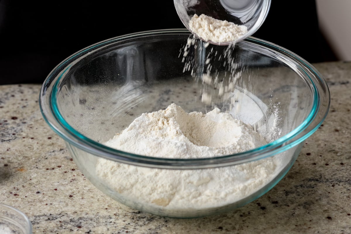 adding dry ingredients to the bowl