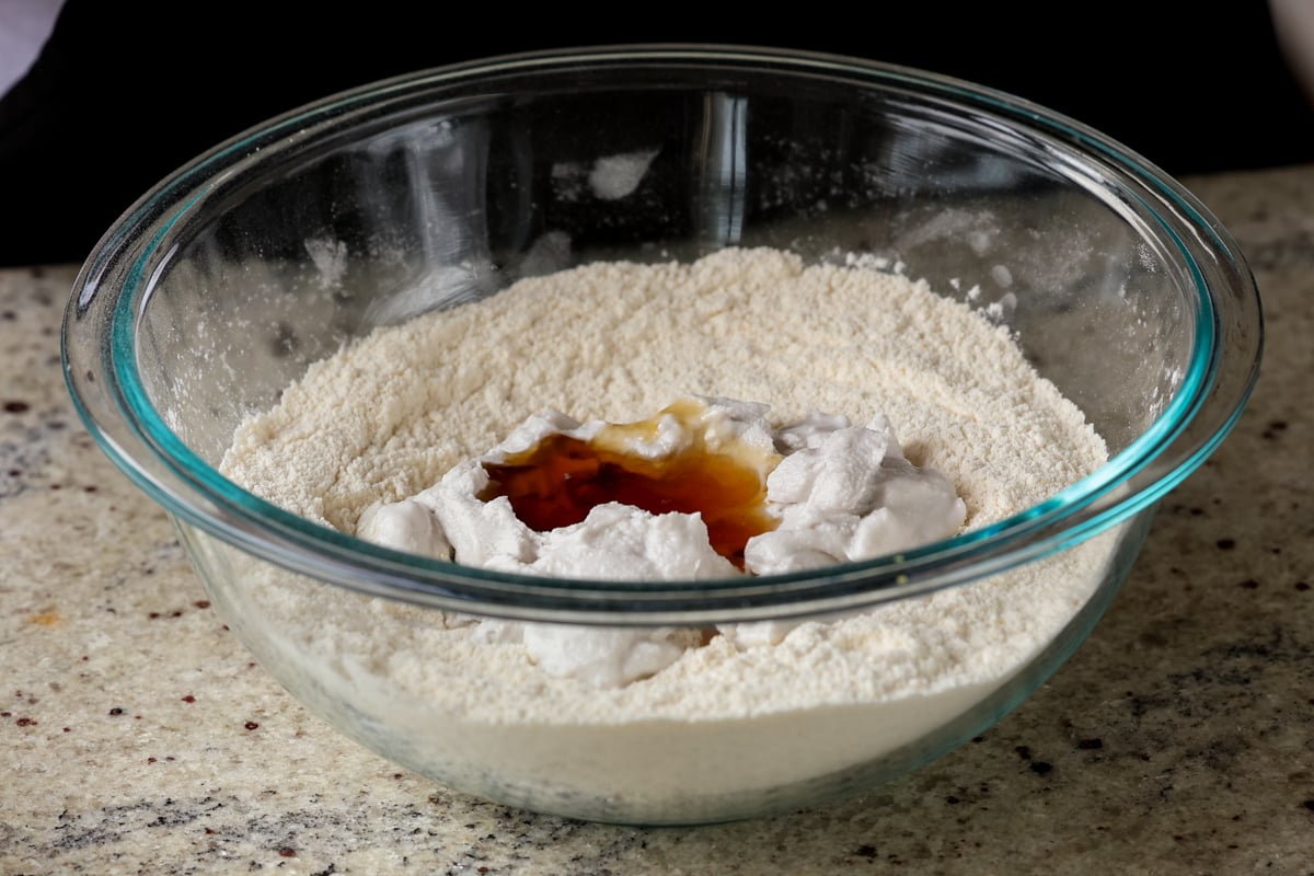 adding wet ingredients to the dry in the same bowl