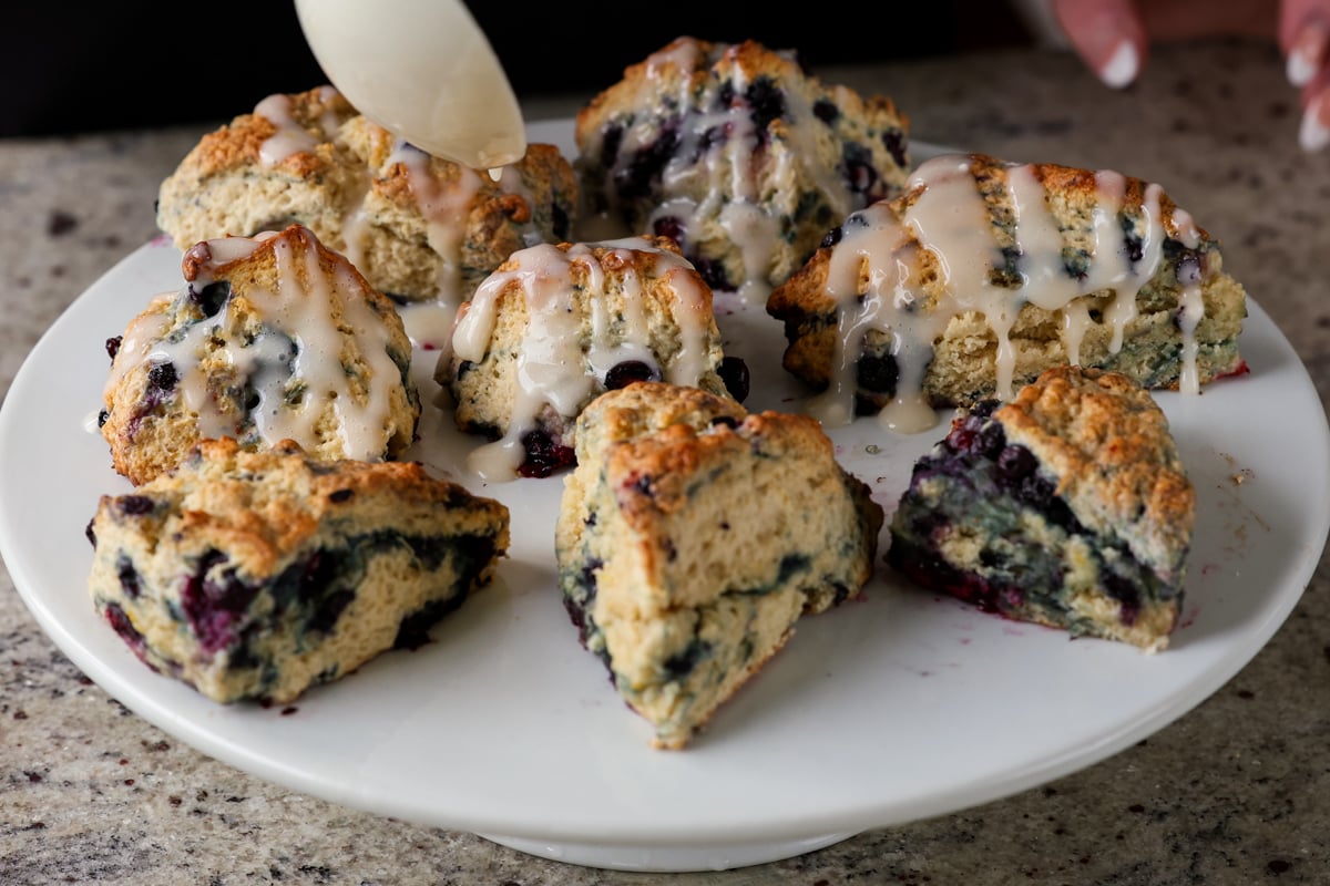 lemon blueberry scones on the plate after glazing
