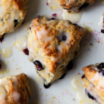 lemon blueberry scones on the serving tray, after glazing