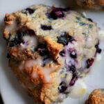 close-up of a glazed lemon blueberry scone