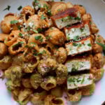 marry me pasta on a white plate with seared tofu pieces
