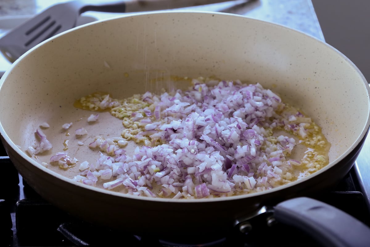 adding onion to the pan