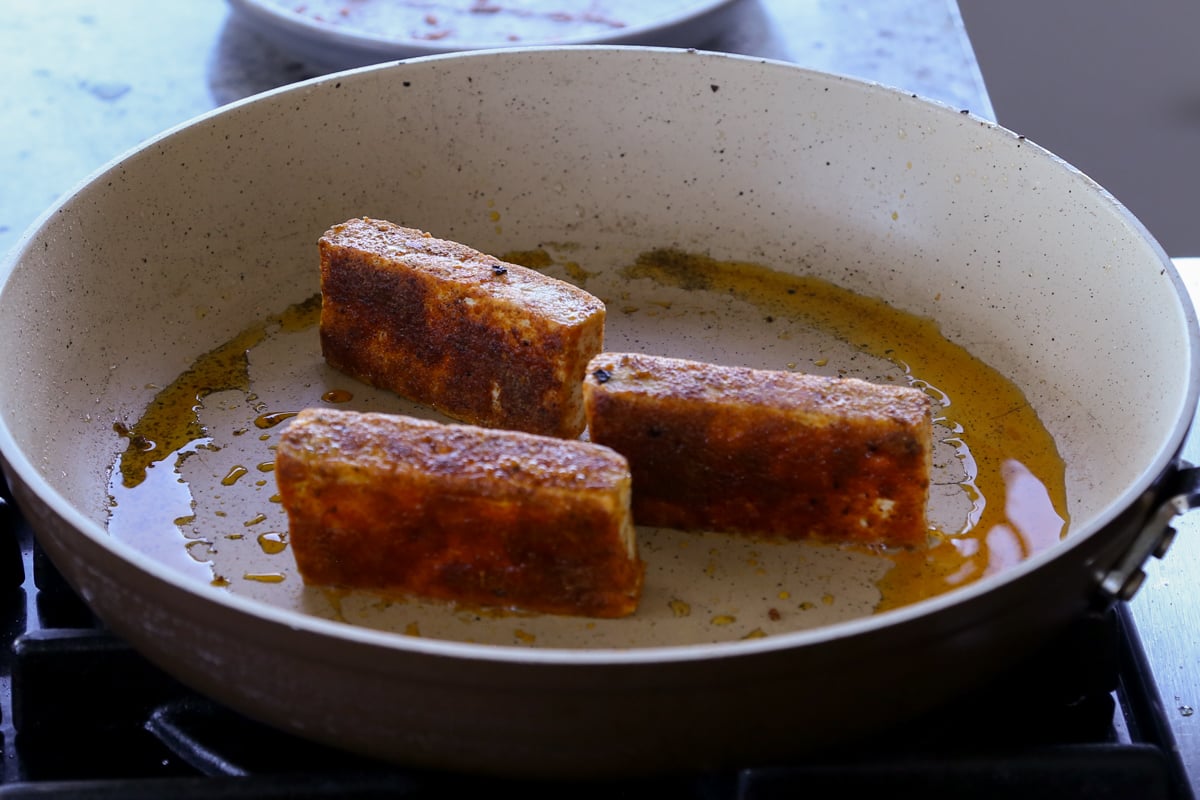 searing the tofu in the pan