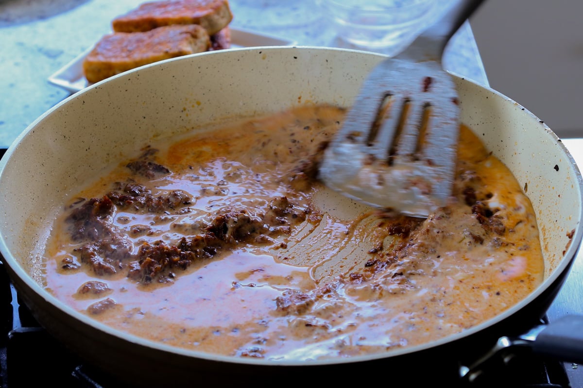 adding the rest of the milk to the pan