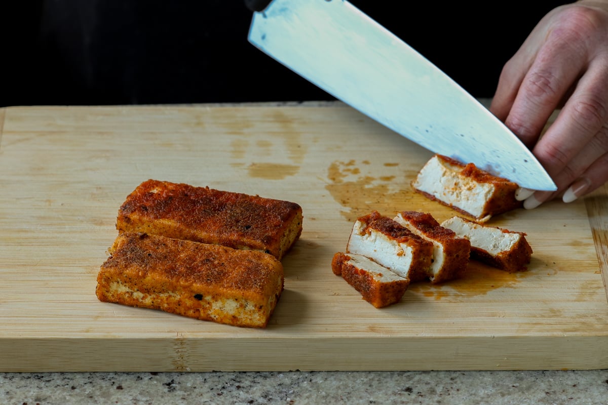 cutting up the tofu into slices