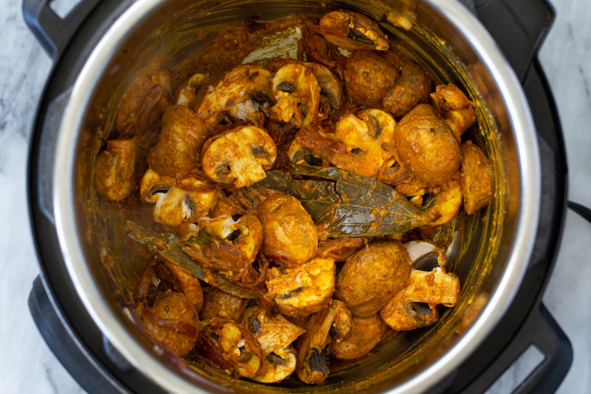 sliced mushrooms tossed in Indian gravy in an Instant Pot