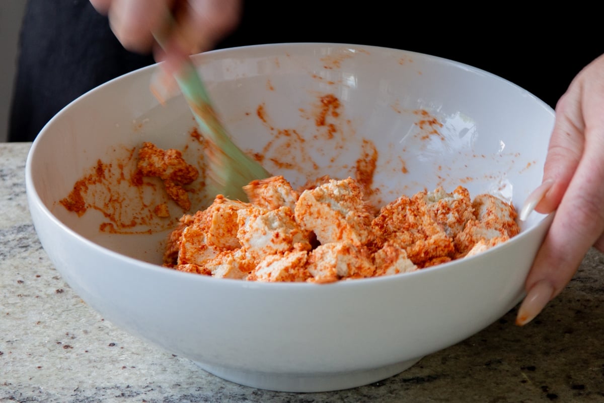 tofu tossed with the seasoned yogurt mixture