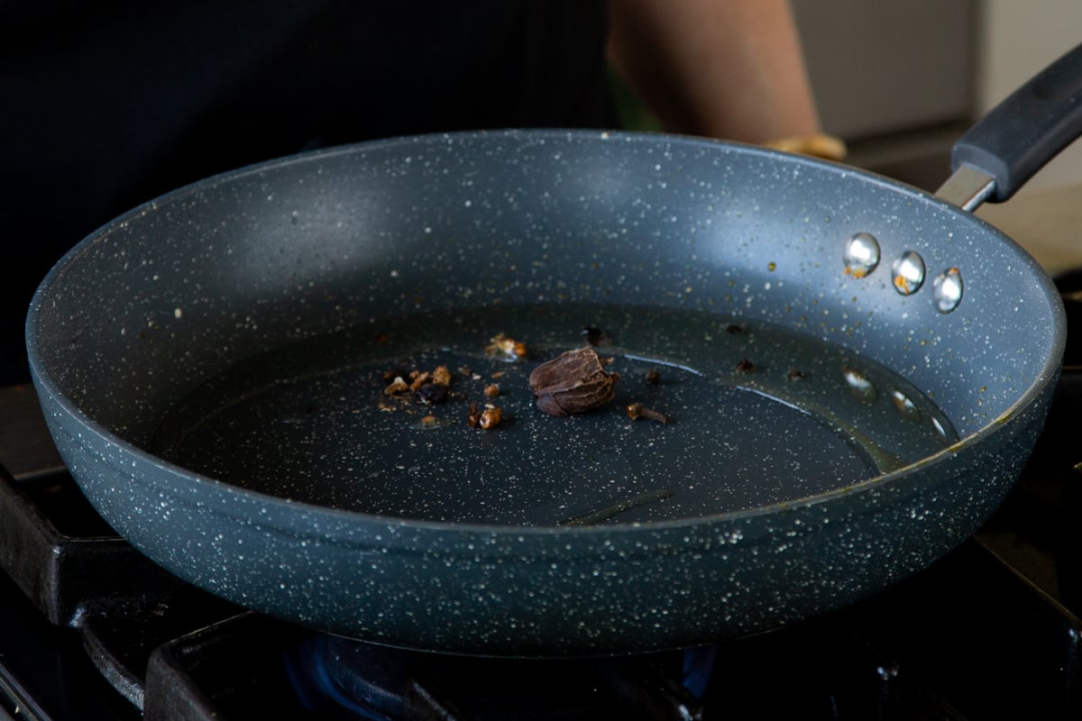 roasting the whole spices in the pan