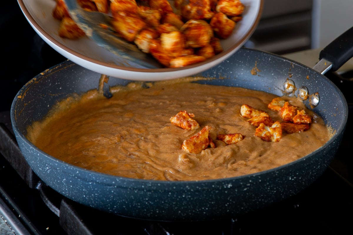 adding crispy tofu "mutton" back to the pan of Pahadi curry sauce