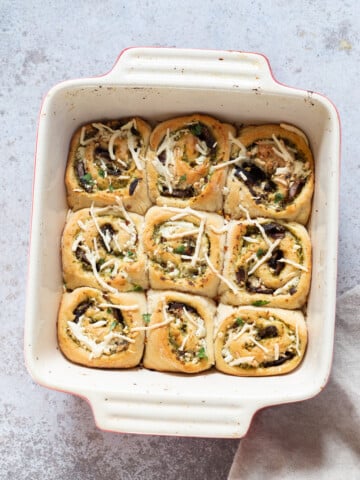 overhead shot of Pesto Pizza rolls in a white casserole dish