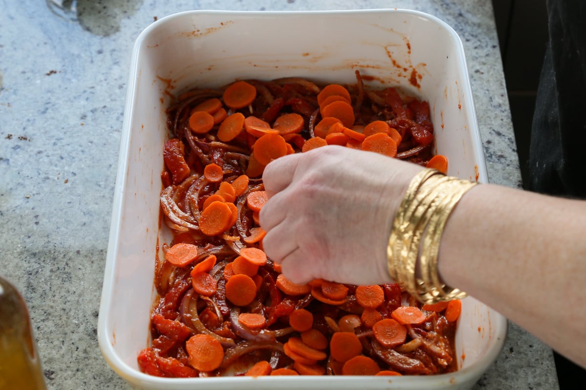 adding the veggies to the pan