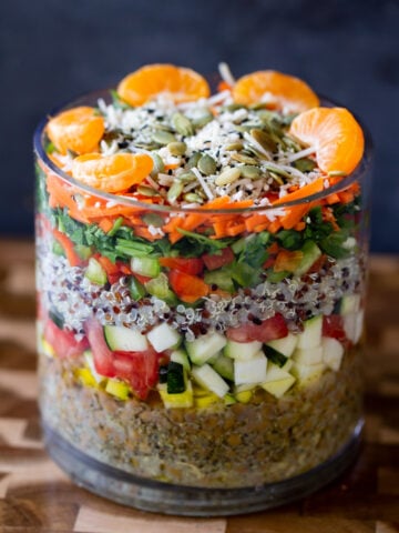 adding orange and seeds layer to the salad