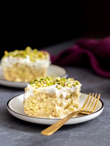 a slice of vegan ras malai tres leches cake