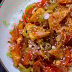 Szechuan tofu on a plate with rice
