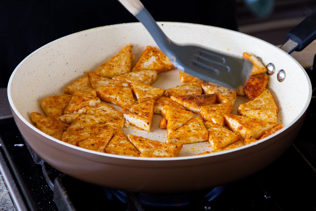 crisping up the tofu in the pan