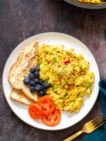 vegan tofu scramble served with a side of toast and vegetables