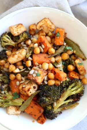 Sheet Pan Veggie Dinner with Broccoli, Sweet Potato, Tofu, Chickpeas, Sunflower seeds dressed with Miso Maple Dressing. #Vegan #Glutenfree #Nutfree #Recipe. Can be #soyfree with chickpea miso #VeganRicha