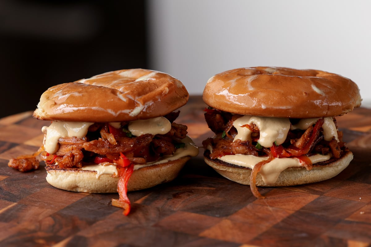 vegan cheesesteaks on a cutting board